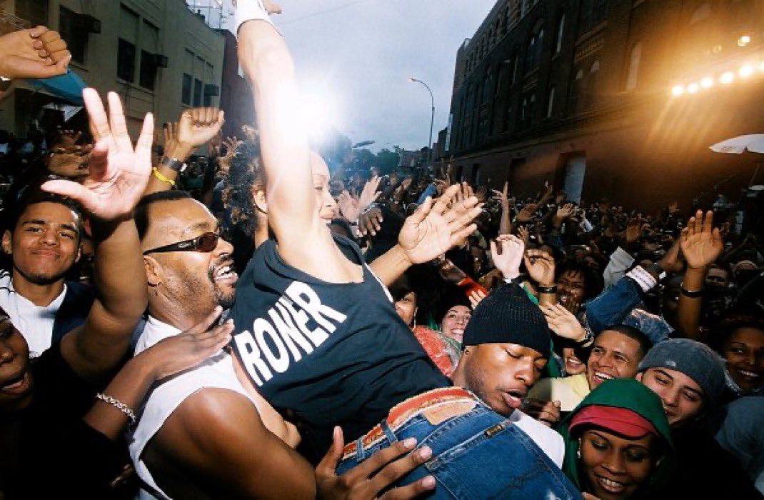 RapWikip's tweet photo. Erykah Badu performing at Dave Chappelle’s Clinton Hill block party with a 19-year-old J. Cole in the background, 22 years ago today 📸 (2004) https://t.co/csuSgnRDbF