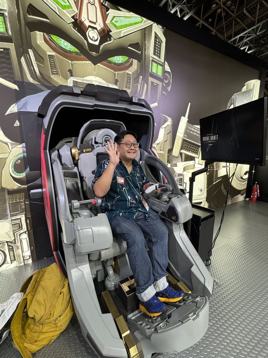 Kakuchopurei's tweet photo. Our own @MrToffee playing Gundam Rogue Orbit on a special cockpit setup. Stay tuned for our preview! #tgs2026 @BandaiNamcoSEA https://t.co/SPczF4tT9j