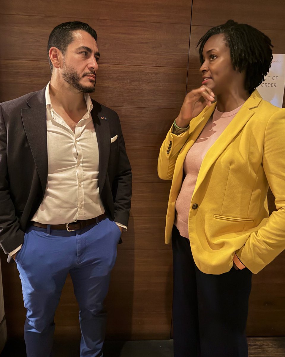 An image of Abdul El-Sayed and Angie Nixon talking to each other.