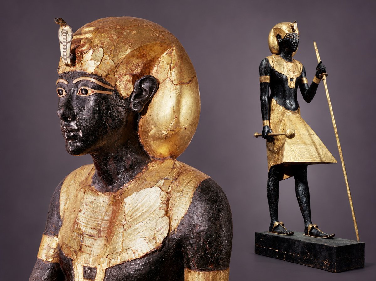 egyptomuseum's tweet photo. Ka Statue of Tutankhamun

New Kingdom, 18th Dynasty, reign of Tutankhamun, c. 1332–1323 B.C.

This striking wooden statue of Tutankhamun was one of a pair found standing like silent sentinels before the sealed entrance to the king’s burial chamber.

In this figure, Tutankhamun wears the khat headdress and holds a mace in one hand, a traditional emblem of royal power, and a long staff shaped like a papyrus stem in the other, symbolising youth and renewal. His body is coated in a deep, lustrous black, a colour associated with the fertile silt of the Nile and, by extension, regeneration, resurrection and eternal life.

Against this dark surface, the details gleam. Gold leaf adorns the king’s headdress, collar, kilt and other trimmings, while his wonderfully lifelike golden sandals even reproduce the appearance of straps around the feet. His inlaid eyes lend the figure an unusually alert, almost watchful expression; particularly fitting for a statue placed to guard the royal burial chamber.

Often described as a Ka statue, the figure could serve as a physical dwelling place for the king’s ka, or life-force, after death. To the Ancient Egyptians, a person was composed of several interconnected elements, including the physical body, the ka, the ba, the name and the shut, or shadow. Preserving these aspects allowed the deceased to continue their existence in the afterlife.

From the Tomb of Tutankhamun (KV62), Valley of the Kings, Thebes.

#AncientEgypt #Tutankhamun

Read more: https://t.co/KTiZAZy2CE