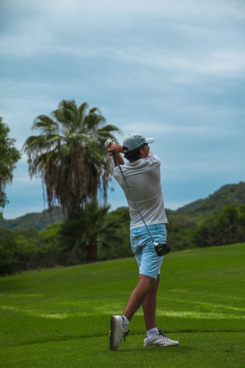 LKortz19183's tweet photo. In a picture near the palmetto hillside, I had open follow-through with a level gaze. Willow leaves and juniper frame were around me. My silver cap, navy backpack, and moss parka were there too. #GolfForm #PalmettoHillsideGolf https://t.co/Vb1LI1ASNG