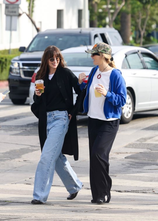 JLawrenceCenter's tweet photo. Dakota Johnson on a video with Jennifer Lawrence that she wants to post:

“I have this amazing video of her. She said, ‘I’m walking past your house,’ and I was living in New York filming a movie at the time. So I opened the window on the top floor and just yelled, ‘Bitch!’” https://t.co/rhEOniXeJ3