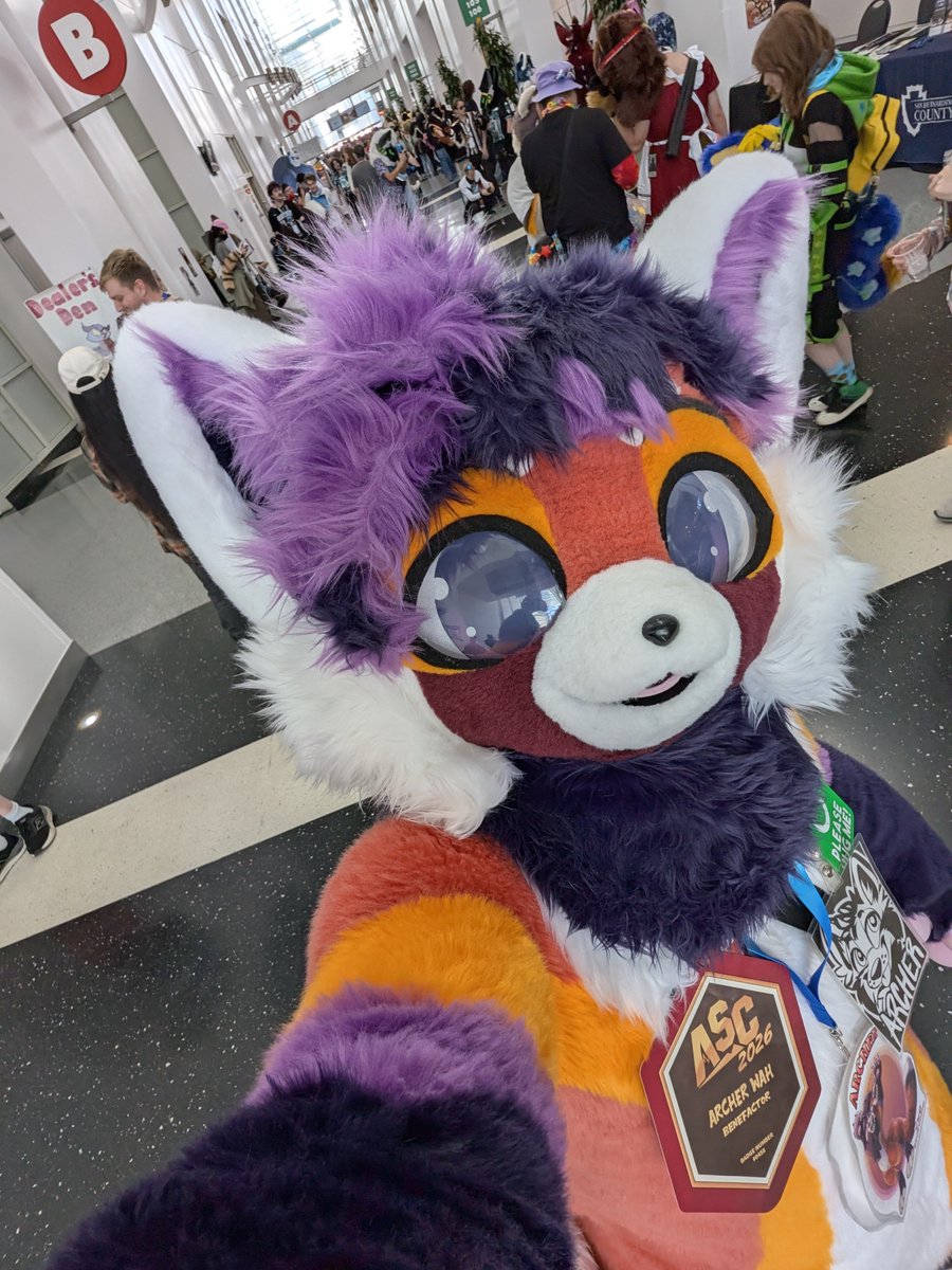 ArcherEmberpelt's tweet photo. Happy #FursuitFriday from #ASC2026! Here, have yet another terrible selfie to commemorate the occasion!

🧶: @kemonokapi https://t.co/HhHrRrYQas