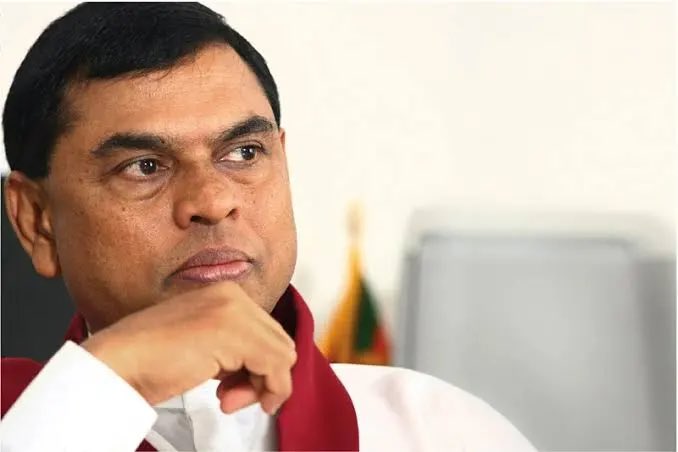 BasnayakeM's tweet photo. An Interpol Blue Notice has been requested to locate former Minister Basil Rajapaksa, who is overseas, to commence proceedings for his arrest, the IGP says. Rajapaksa faces money laundering charges over the purchase of land at Brown's Hill in Matara and distribution of 12,000 T-shirts during the Uva PC election at a cost to the Tourism Promotion Bureau of LKR 7.8 million #Lka