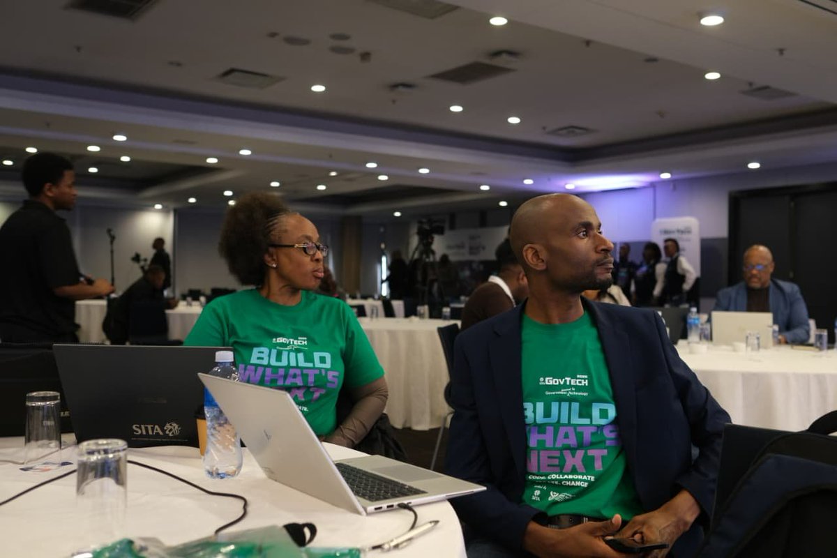 sitasocltd's tweet photo. SITA Cluster Advocate Khanyisa Mbelekane and Semakelang Thulare from Statistics South Africa attentively listen in while a contestant presents his Hackathon solution. #SITAGovTech2026 #GovTech2026Hackathon #GovTech20Years https://t.co/SW1Q19n9ip