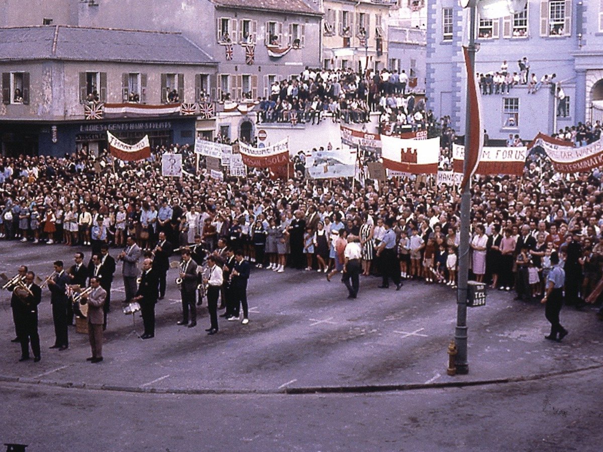 GibraltarGov's tweet photo. On 19 September 1963 Joshua Hassan and Peter Isola left for New York.

They went to put Gibraltar's case to the UN Committee of 24. It was the first time Gibraltarians spoke for Gibraltar on an international stage.

They came back to crowds in John Mackintosh Square. https://t.co/HnHGaYIeCW