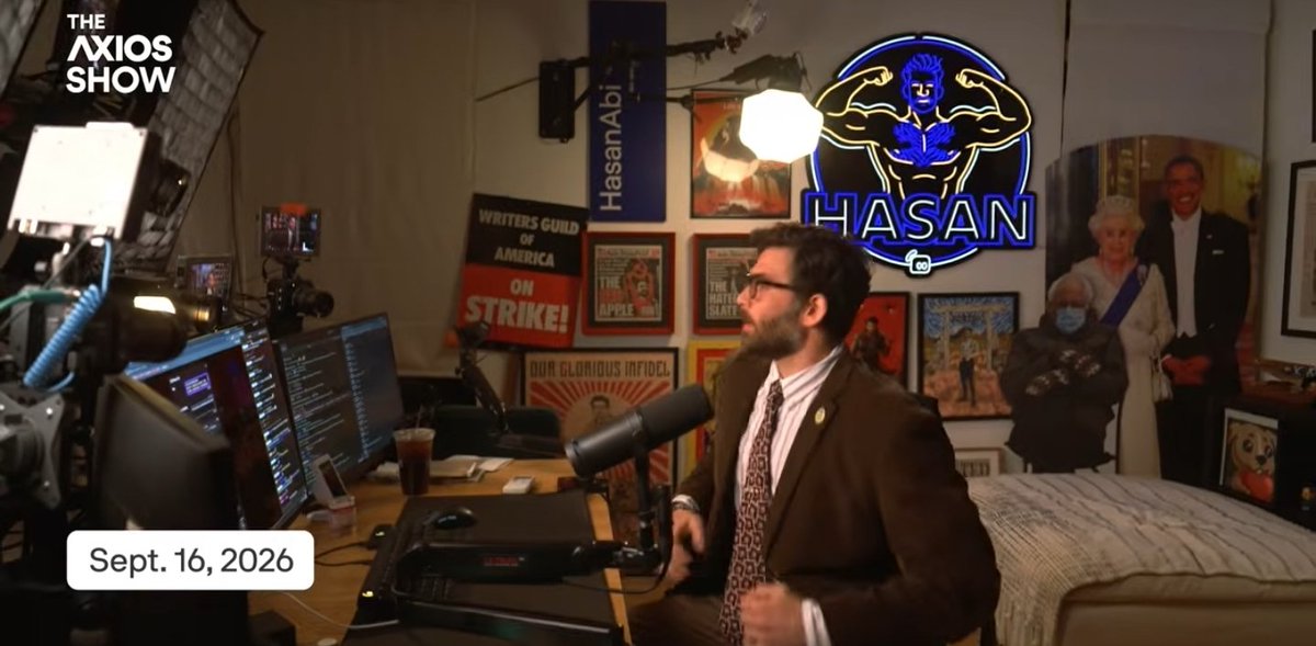 m0ntilyett's tweet photo. The concept of Hasan wearing a suit to be taken seriously while sitting in a room full of pictures of himself. The Patrick Bateman of streaming. https://t.co/SIo6JA2RDo