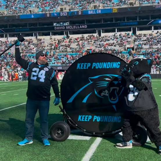 TalonHIFL's tweet photo. In 2012, the Carolina Panthers introduced the pre-game tradition of the Keep Pounding drum. 

If you're a @Panthers fan you know the history of that phrase and why we have the drum.  

When my mom was battling stage 4 Lung Cancer in 2013-2014 she adopted the Keep Pounding mantra (albeit, she kept saying "Keep On Pounding") during her fight and it became that much more important to me.

In 2024 when I brought my brother with me to our annual pre-Christmas game home game, I watched as @dmcland72 was announced as the Drummer, an honor given to him as being our 2024 fan of the year.  He pounded the hell out of that drum and I remember looking at my younger brother and saying: "Dude, it would be such an honor to be in that position one day, could you imagine?"

Little did we know that a year later I would be named Carolina Panthers 2025 Fan of the Year.

The FIRST words out of my mouth when the team surprised me with the news that I was FOTY and going to the super bowl was: "Does this mean I can Pound the Drum?!"   ...Not "OMG Im going to the super bowl" or anything else... The first question I asked in the heat of the moment was "Can I pound the drum?"

It means that much to me.

Since then, I have had so many amazing experiences with the Panthers and our fans.  One of the most important has been my friendship with @chrisdraft who played 12 years in the NFL and has become a huge mentor for me in helping me to become a bigger voice in the Lung Cancer advocacy space. 

I have worked hard to do more as a Lung Cancer advocate and to bring attention and raise money for lung cancer research.  Not for any recognition, but to pay tribute to my Mom and to help those still fighting or who will one day fight lung cancer themselves.  

Next month is the NFL's Crucial Catch Month, where all 32 clubs do more to bring attention to "intercepting cancer."   Encouraging fans to get screened, making donations to cancer research, and honoring cancer survivors, caregivers, and medical professionals across the country. 

I have reached out to my team rep from last year and expressed my desire to be the team's Keep Pounding drummer for our Crucial Catch game this season, and it would mean the world to me to be given the honor to Sound the Drum in recognition of all those who are currently fighting any form of cancer.

Spread the word.  Help me Sound the Drum!  

#KeepPounding