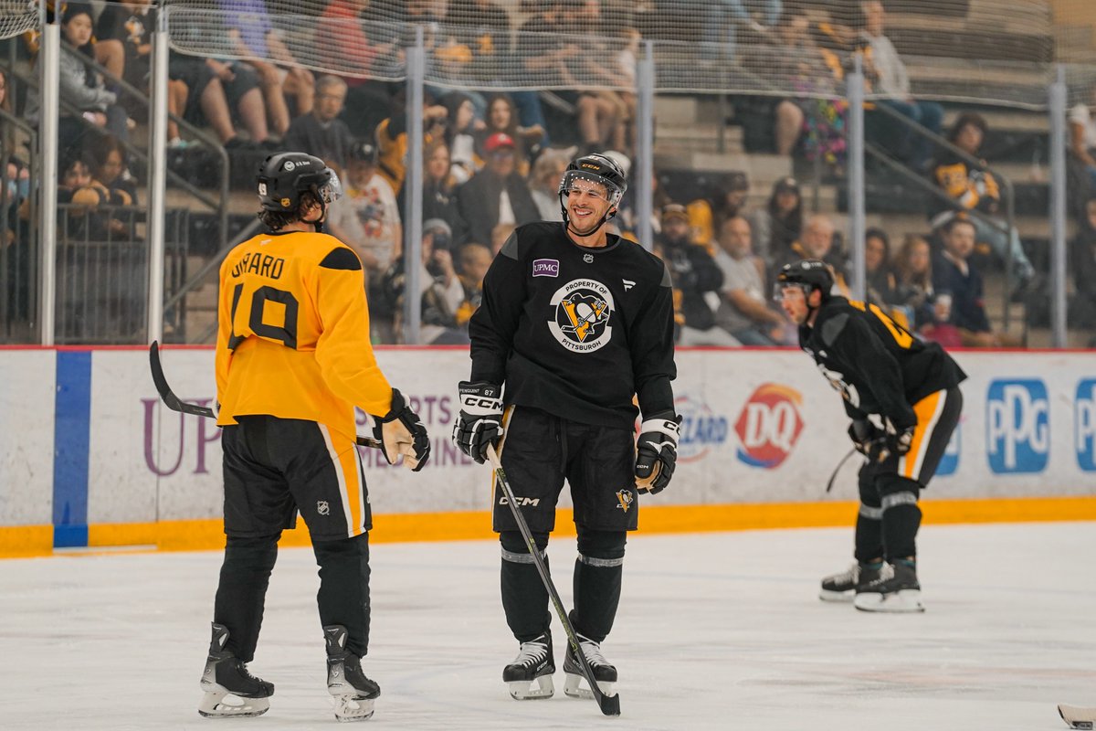 Photo of Sam Girard and Sidney Crosby on the ice at training camp.