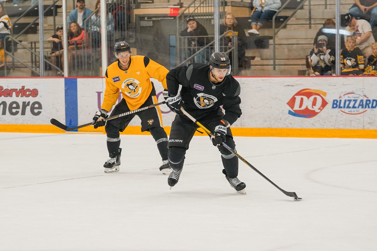Photo of Ben Kindel and Egor Chinakhov on the ice at training camp.