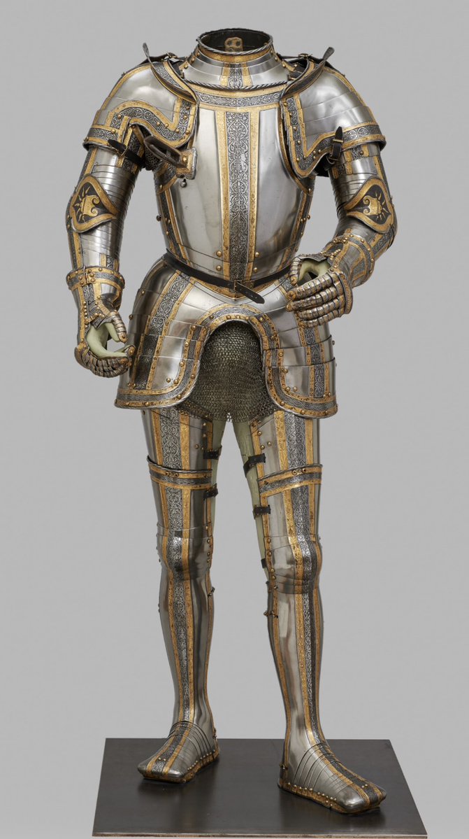 Argonaut1535's tweet photo. 🇵🇹🇪🇸🇩🇪👑Etched & Gilt Field Armor for the (Future) King Philipp II Habsburg (1527-1598) ca. 1544.

Made in Augsburg by Desiderius Helmschmied (1513-1579)

Charles V commissioned this armor from his Augsburg court armourer Desiderius Helmschmid in 1544 for his then 17-year-old son Philipp. The armour was once part of a large garniture, additional pieces of which have survived in Madrid (Real Armería, invs. A 189 et al).

In 1571, the imperial diplomat Adam of Dietrichstein journeyed to Austria, bringing with him this armour and another one made for Emperor Charles V as gifts from Philip II, King of Spain, for Archduke Ferdinand II. 

Dietrichstein was accompanying Archduke (later Emperor) Rudolf II and his younger brother Ernest, who were returning to Austria after a lengthy sojourn at the court of their uncle, Philip II.

Back in Austria there seems to have been some delay in transporting these two armours from Vienna to Innsbruck, because the following February we find Ferdinand impatiently enquiring about them. 

He asked for them to be ‘carefully packed’ (gut verpackt) and to be dispatched to Innsbruck immediately. They seem to have arrived in the spring of 1572 and were installed in the Armoury of Heroes at Ambras Castle. 

Philip’s armour was first listed in the 1583 inventory as ‘Philip II, King in Spain. 

A white cuirass with gilt and etched bands’ (Phillipus der Ander, könig in Hispnia. Ain plankher khürisz mit verguldten und göczten reifen).

Today, Philip’s armour is displayed without a helmet because whoever packed the pieces in Madrid in 1571 packed the wrong helmet. 

The helmet mistakenly dispatched to Vienna is a close burgonet (Kunsthistorisches Museum Vienna, Imperial Armoury, from the so-called Algiers Garniture made for Charles V around 1540 that also remains in Madrid.

Height: 167 cm Weight: 18 kg