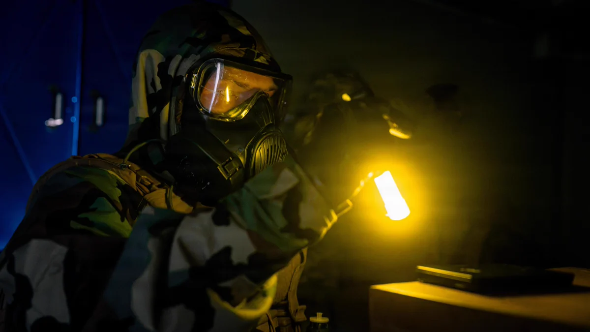 A U.S. Marine with the chemical, biological, radiological, and nuclear defense element, Headquarters Battalion, 3rd Marine Division, inspects a hard drive during sensitive site exploitation training on Camp Hansen, Okinawa, Japan, Sept. 10, 2026. This training event refined the Marines\u2019 ability to conduct reconnaissance, surveying, sampling, technical decontamination, and emergency extraction during SSE operations. (U.S. Marine Corps photo by Cpl. Joaquin Dela Torre)