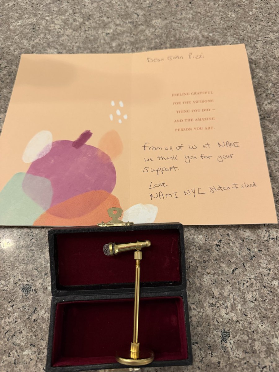 JohnPizzi's tweet photo. I meant to mention I performed a fundraiser show for a really wonderful organization called #NAMI  (the National Alliance on Mental Illness) is the largest grassroots mental health organization in the United States, providing free support, education, and advocacy for people affected by mental illness

And as I  left was gifted this wonderful and thoughtful thank you card and boxed mini Mic stand and microphone.

So cool and so considerate of theses members. Thank you for your gift but even more so for the work you all do!!