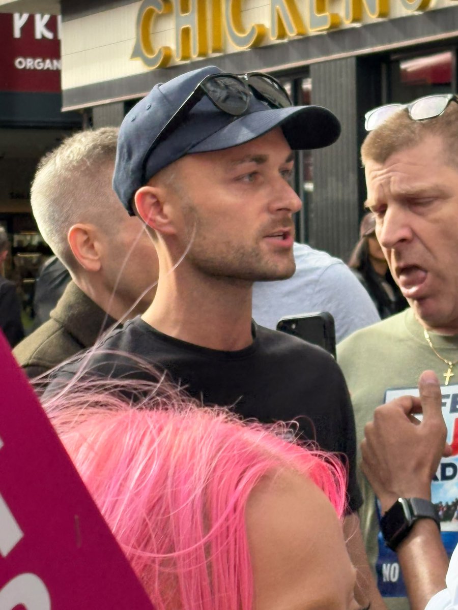 AntiRacismDay's tweet photo. Earlier @RupertLowe10 claimed that his campaigner manager in Holborn, Lewis Holmes, had been attacked with boiling liquid. Police now say a passerby knocked his coffee, which he spilt on his leg. Restore are liars. Holmes is pictured here today with neo-Nazi Patrick McGinnis https://t.co/qj2AyuN4li