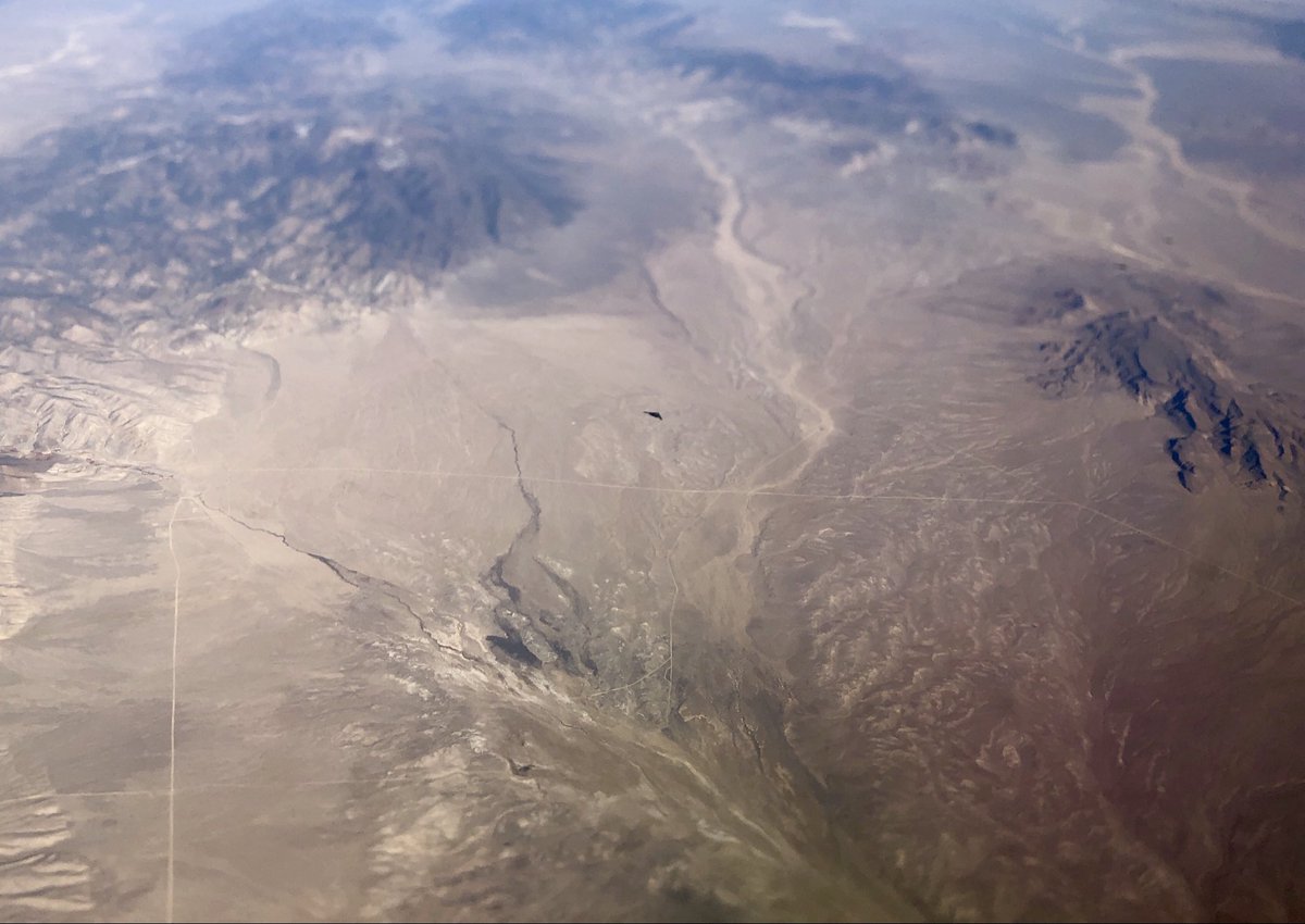 colemanm's tweet photo. Post your best airplane-window photo.

(When I spotted a B-2 over the Nevada basin and range) https://t.co/sPIogEu98q