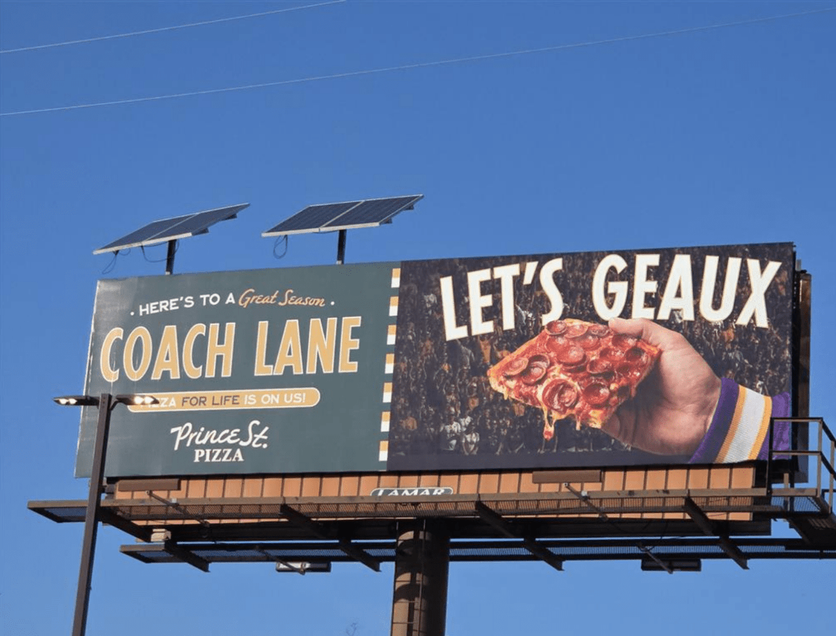 LAFirstNews's tweet photo. New York-based Prince St. Pizza will offer LSU football coach Lane Kiffin free pizza for life via a new billboard as the restaurant prepares to open its first Baton Rouge location in October 2026. https://t.co/vAA8vAa26I