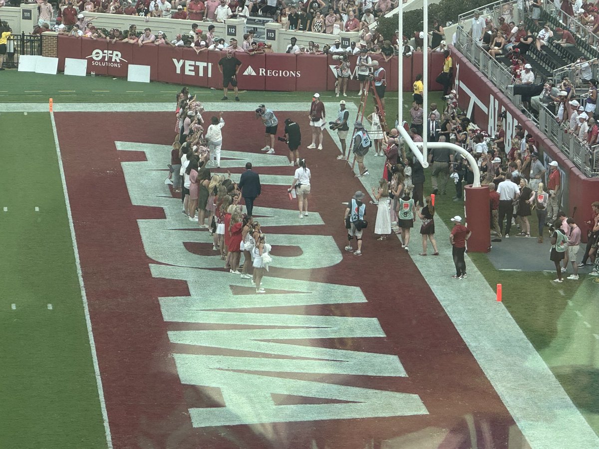 Corey_Clark's tweet photo. Nick Saban out here honoring teachers in the end zone. During a lightning delay. Is it dangerous out there or not? Don’t the lives of teachers matter too? https://t.co/GCMmHw69o1