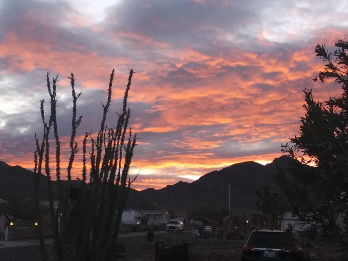 McentireTravis's tweet photo. They hide in the Clouds and they produce lights this was real early in Yuma AZ I take alot of weird photos of the clouds . Front yard it is weird when yuma it is very windy but clouds stay still ! The sun has not risen yet  rest of the sky is grey clouds .... https://t.co/aHeTNNSTDD