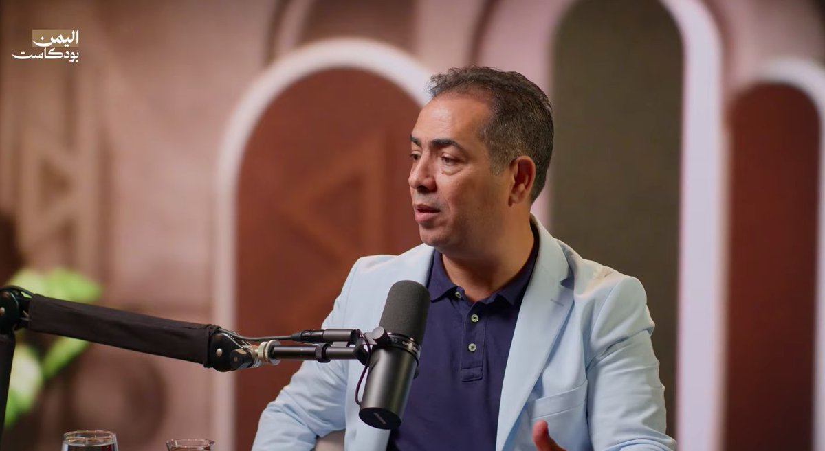 BashaReport's tweet photo. Another Yemen Podcast from my favorite podcaster @osamaalqutaibi, with two prominent journalists, @YemenShababNet’s @dubalh and @BelqeesTV’s @AhmadALzurqa, to discuss how the Houthis won on the West Coast.

Ahmed: “We defeated ourselves before Iran defeated us.”

Abdullah: “Iran turned the Houthi militia into a state, while our allies turned us from a state into something resembling a militia.”

Part I.

The podcast asks three connected questions. Why did Mocha and Bab al-Mandab fall? What are the Houthis doing with their gains? And what would have to change for their opponents to recover?

Abdullah and Ahmed do not offer a single explanation for the collapse. They describe a combination of battlefield pressure, divided command, political competition, dependence on outside support, and decisions that were not made when the front was still holding. They also discuss allegations of betrayal and deliberate Saudi inaction. Those allegations are part of the conversation, but neither journalist establishes them as solid facts.

Abdullah draws the distinction at the outset. “We said it was not a handover or betrayal. But it was not normal either. It was incapacity and failure.”

His account begins before the final Houthi breakthrough. He says the West Coast had been under sustained attack for weeks, with missiles and drones inflicting losses that were not fully disclosed. The Houthis initially pressed the northern positions around Hays and Al-Khokha before breaking through at Al-Barh. The loss of Al-Barh junction was followed by the fall of Khalid bin al-Walid camp. Once Houthi forces reached a command-and-control center behind the forward positions, the danger of encirclement spread across the defensive line.

The withdrawals that followed made the collapse look sudden, but Abdullah argues that its causes were much older. “There was incapacity and failure more than betrayal.”

The West Coast @NRFYemen forces had been assembled under @modgovae sponsorship from three main components: southern fighters @SouthArmed @alamalikah, Tihami resistance forces, and Tariq Saleh @tarikyemen's National Resistance. The UAE provided a common authority and much of the organization that allowed these formations to operate together. When it withdrew, the forces remained, but their separate loyalties, command arrangements, and political interests did not disappear.

Abdullah credits the Emiratis with earlier military gains. His criticism is that they moved from building a fighting force to building political influence before the military project was complete. He points to the Southern Transitional Council @STCSouthArabia and the National Resistance Political Bureau @P_B_N_R as examples of political ambitions overtaking military priorities. ��Rushing the transition from military work to political work ruined both,” he says.

Ahmed is equally critical of what happened after the UAE’s departure. He argues that the Houthi attack was foreseeable, yet the government, Tariq Saleh, and Saudi Arabia @modgovksa failed to prepare a coordinated defense. The Taiz and West Coast fronts were connected geographically but divided operationally. Forces holding positions around Jabal Habashi and other areas answered to different commands from those farther west.

The claim that the armed forces @YemenMOD had been unified does not convince him. “Perhaps on paper. Administratively, they were integrated. Operationally, there was a very serious failure.”

That is one of the clearest explanations in the discussion. The problem was not simply whether there were enough brigades or enough fighters. It was whether anyone could direct them as a single force when the Houthis attacked. 

Ahmed raises allegations about personnel records, undisclosed military facilities, and the deterioration of trust between Saudi officers and Tariq Saleh. 

Abdullah describes the Houthis concentrating fighters and firepower against weak points along an extended defensive line. He says Houthi drones targeted artillery crews and supporting Multiple Launch Rocket System (MLRS) units, weakening the infantry’s ability to hold its positions. Abdullah also argues that Saudi air cover was largely absent during crucial periods. Ahmed agrees that air support mattered but insists that its absence cannot explain away the failures of preparation and command.

The discussion then turns to the allegation that Saudi Arabia deliberately allowed the West Coast to fall. The journalists consider whether Riyadh distrusted Tariq because of his Emirati ties and whether Saudi decision-makers wanted to reduce his military independence. Ahmed raises a further theory: that a Houthi advance to Bab al-Mandab might force the international community to confront the group and shift some of the burden away from Saudi Arabia.

Abdullah places more emphasis on indecision and failure. “If Saudi Arabia had been serious about preventing Mocha’s fall, it could have done so with its own capabilities, without American intervention,” he argues. That is his assessment of what Saudi Arabia could have done, not proof that intervention would necessarily have changed the outcome.

The journalists are particularly angry about what happened to the men left behind. They describe fighters stranded during the withdrawal, personnel on the islands without adequate evacuation arrangements, and soldiers who were captured or abandoned. They accuse the government and military leadership of failing to take responsibility for those who had fought under their command.

Ahmed asks where the operations room was and who was responsible for the men left exposed. He argues that leaders were preoccupied with explaining the defeat instead of accounting for their forces and rebuilding them. In his telling, the loss cannot be assigned to Tariq alone. Responsibility extends to the government and the coalition because all had a role in the military structure that collapsed.

The podcast also discusses large numbers of dead, captured, and displaced people. These figures are estimates given during the conversation rather than independently established totals. Abdullah describes the effect on Tihami communities whose members had fought for years and on families forced to flee yet again. The human consequences make the debate about command and responsibility more than an argument between political factions.

The first part of the conversation ultimately challenges the idea that the fall of Mocha can be explained by one dramatic moment. The Houthi breakthrough mattered, but the journalists argue that the military system had been weakened by years of divided authority and unfinished institution-building. The retreat revealed those weaknesses all at once.

Part II. 

The second part of the conversation turns from the collapse to the territory the Houthis have gained. Abdullah describes a coastal strip running through Hays, Al-Khokha, Mocha, and Dhubab toward Bab al-Mandab. He says the Houthis reached the strait and moved onto islands, including Perim, also known as Mayyun. His description is a claim about the battlefield at the time of the recording, not an independently verified map of control.

Abdullah is careful about the Kahbub mountains, which overlook the strait from the landward side. He says the Houthis are fighting the Southern Giants Brigades there and have not secured the entire area. “It is still a contested area, with advances and retreats between them and the government forces,” he explains. Abdullah considers the heights more consequential than simply occupying exposed coastal ground because of the military leverage they could provide over the passage. 

He also cautions against confusing a dramatic territorial announcement with the completion of a military operation. Abdullah describes the initial Houthi presence in parts of the newly captured territory as relatively light and suggests that publicity surrounding the advance may have run ahead of consolidation. His concern is what happens if the Houthis are given time to entrench themselves.

The discussion then widens to Taiz and Ma'rib. Abdullah believes the Houthis will first try to secure their gains around Mocha and Bab al-Mandab. He then describes possible pressure eastward from Kahbub toward Al-Turbah and the routes serving Taiz, alongside pressure toward the Safer oil facilities in Ma'rib. These are the objectives he anticipates, not confirmed plans. His argument is that the West Coast cannot be understood in isolation from the other fronts.

Ahmed makes the same point through the contrast in command structures. He says the Houthis have “one operations room, one decision, one movement,” allowing them to apply pressure from Taiz to Al-Bayda while their opponents remain divided. He also argues that the Houthis benefit from Iranian military support and from their opponents' inability to build an equally coherent force. His criticism is directed as much at the government and its allies as at the Houthis themselves.

One of the sharpest exchanges comes when the journalists compare the two sides' military development. Abdullah says, “Iran turned the Houthi militia into a state, while our allies turned us from a state into something resembling a militia.” It is a deliberately stark criticism of the way outside powers have supported competing Yemeni formations. He argues that the Houthis have developed missiles and drones while government-aligned forces have remained constrained by decisions made in Riyadh and Abu Dhabi.

The conversation also examines the Houthis' attempt to reassure foreign governments after reaching Bab al-Mandab. The speakers discuss statements suggesting that navigation would remain open and that the Houthis' immediate dispute was with Saudi Arabia. Abdullah compares this approach to the group's earlier assurances to tribes in Amran, arguing that limited promises can help a force consolidate control before its position changes. He sums up his skepticism in one sentence. “Whoever can permit passage can also prevent it.”

The podcast does not establish that the Houthis have made a secret deal with Washington or any other government. The journalists discuss reported communications and speculate about what the Houthis may be offering in exchange for international restraint. They also consider whether pressure at Bab al-Mandab is connected to Iran's confrontation with the United States around the Strait of Hormuz. Those are interpretations of regional strategy, not demonstrated agreements.

For Abdullah, the broader cost is that each territorial gain makes the next confrontation harder. “Every time the Houthis take a commanding or strategic area, their appetite grows, and they begin working on the next area,” he argues. He says recapturing lost territory is possible but becomes more costly the longer the Houthis are allowed to consolidate it.

Ahmed also worries about the psychological effect of the defeat. The idea that the Houthis cannot be beaten becomes stronger with each collapse, while accusations of betrayal spread among the forces opposing them. The journalists connect this loss of confidence to a much wider failure of government. They describe unpaid salaries, poor treatment of displaced families, and armed formations organized around increasingly narrow regional identities. In their account, these divisions undermine the very idea of a national army.

Part III. 

That leads naturally to the final question. What would have to change?

The journalists agree that another round of recruitment or another collection of brigades would not, by itself, address the problem. They argue that the government needs a clear political decision, an effective command structure, reliable support, and an end to the competition between military factions. Ahmed puts it simply. “The problem is not the men. The problem is the political decision, the management of the battle, and the clarity of the vision.”

They disagree, however, over how quickly lost territory could be recovered. Abdullah argues that the West Coast could be retaken if there were a genuine decision, effective air support, professional management, and a reorganized force. But he also warns against promises of an immediate march on Sana'a. “Anyone who tells you we are ready to liberate Sana'a is lying,” he says. He describes the available forces as exhausted and demoralized, requiring time to rebuild their capabilities and confidence.

The disagreement is important because the podcast is not simply a call for an immediate offensive. Its speakers recognize the damage caused by the retreat. Abdullah recounts seeing a video of a fighter who apologized to the people of Al-Khokha for withdrawing. He contrasts that individual apology with the absence of accountability from senior officials. His point is that a soldier who lost his position showed a sense of responsibility that he believes was missing among the people who directed the war.

Ahmed argues that the leadership itself must change if the government wants to restore confidence. He calls for officials, commanders, and security institutions to operate from inside Yemen rather than remaining abroad. Ahmed also wants an end to political quota-sharing and a clearer division of responsibility between political leaders, military professionals, and government institutions. He asks how people can trust promises about the future when the government cannot provide a convincing answer about the present.

The discussion repeatedly returns to the danger of fighting disconnected battles without an overarching political objective. Ahmed criticizes the pattern of sending men to capture individual hilltops only to order them to withdraw shortly afterward. He argues that military decisions should be made by professionals and that the government must consider the people displaced by its operations. 

The journalists also question whether Saudi Arabia has a clear long-term vision for Yemen. Ahmed asks whether Riyadh sees Yemen as part of its strategic security and therefore needs a strong Yemeni state, or whether it sees the country primarily as a sphere of influence. He argues that the current leadership arrangements have failed to produce a functioning state. Abdullah similarly insists that Yemeni and Saudi interests should be treated as shared interests, not as favors one side grants the other.

Their discussion of the United States and other regional powers is less certain. Abdullah predicts a wider confrontation between Washington and Tehran after the November mid-term elections, while Ahmed considers the possibility of international involvement over maritime security. These are their forecasts, not established future events. Both speakers nevertheless question the assumption that Yemen's government can wait for foreign intervention to solve its problems.

The final minutes bring the conversation back to responsibility. Ahmed says Yemen has experienced enough improvisation, fragmented decisions, and costly mistakes. He argues that political leaders should make political decisions, military experts should manage military affairs, and officials should be accountable for the consequences. Ahmed closes with a line that captures his interpretation of the entire war. “We defeated ourselves before Iran defeated us.”

That is the central argument running through the episode. Abdullah and Ahmed see the Houthi victory on the West Coast as a military success made possible by the failures of their opponents. They disagree on some details and speculate about the calculations of foreign governments, but both return to the same unresolved problem. The forces that lost Mocha were never made into a unified, accountable institution capable of fighting independently of their sponsors. Until that problem is addressed, the podcast argues, recovering territory and holding it are two very different challenges. 

https://t.co/Ntu9Wu2TPd