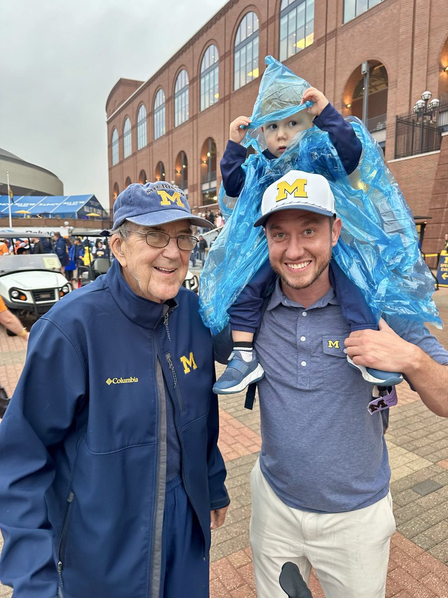 WolverineChron's tweet photo. The synchronicity of this picture is insane. Real Michigan fans will understand how crazy this is. After the game today, I stopped by a tree outside the Lloyd Carr tunnel, where I spread my dad’s ashes. I told my Dad that Tommy Carr threw his first touchdown today. I turned around and Lloyd Carr was standing there. I told him that he is a hero of mine because me and my Dad’s best memories were watching his team’s play, which is inspired me to name my son Woodson. I got to mention how cool it was to see Tommy throw his first TD and then we took this pic right between my dad’s ashes and the tunnel named after Lloyd. I’ve been lucky enough to meet a lot of Michigan legends but this one takes the cake.