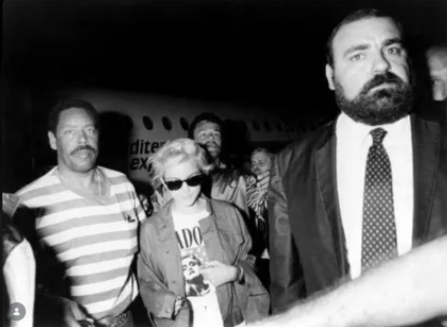 MRfansarchives's tweet photo. MADONNA — FLORENCE AIRPORT, 1987 | 
A restoration of an old newspaper clipping showing Madonna wearing a tour shirt, with her bodyguard Clay Tave, arriving at Florence Airport after a late-night flight from Turin, during the night of September 4–5, 1987. ✈️

#Madonna https://t.co/dWqzpITo68