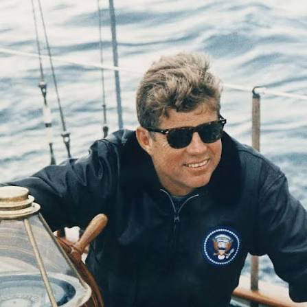 asonflower's tweet photo. Those Sunglasses!!! 😎
Brand: AO Saratoga.
- The same frame JFK wore on the water.
- Presidential seal on JFK’s jacket. 
- Presidential seal on DJT’s headphones.
- JFK Jr. was flying a Piper Saratoga.
- Same name. 
- Same shades energy.
It’s a double whammy.
THEY’RE NOT EVEN READY. 😎🇺🇸