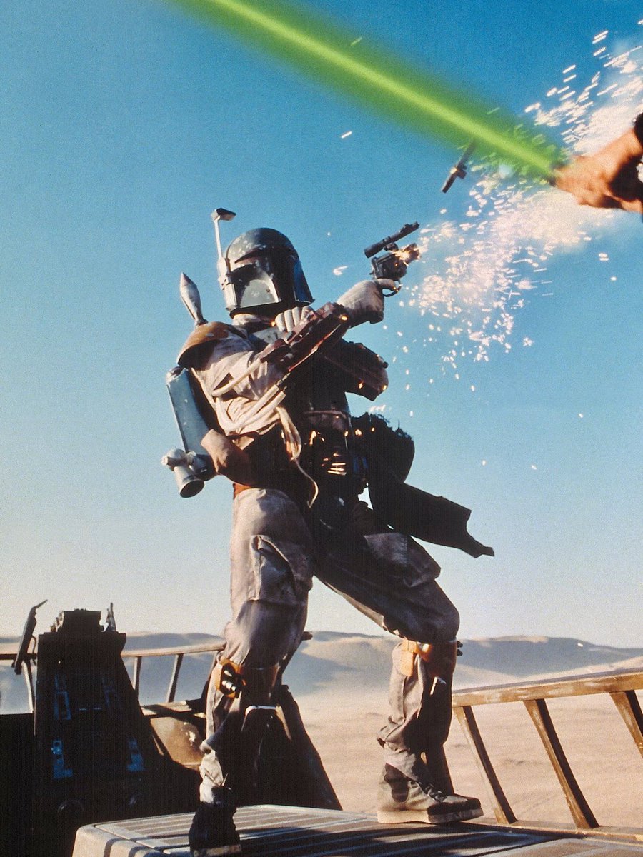 SciFiArchives's tweet photo. A striking publicity still from ‘Return of the Jedi’ (1983), capturing Boba Fett in action. https://t.co/E9PqzaNXID
