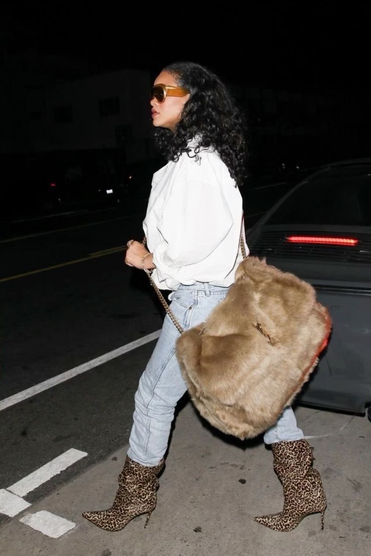 reininavy's tweet photo. riri with the saint laurent niki shearling bag, nyc https://t.co/rbSJLM3iI4