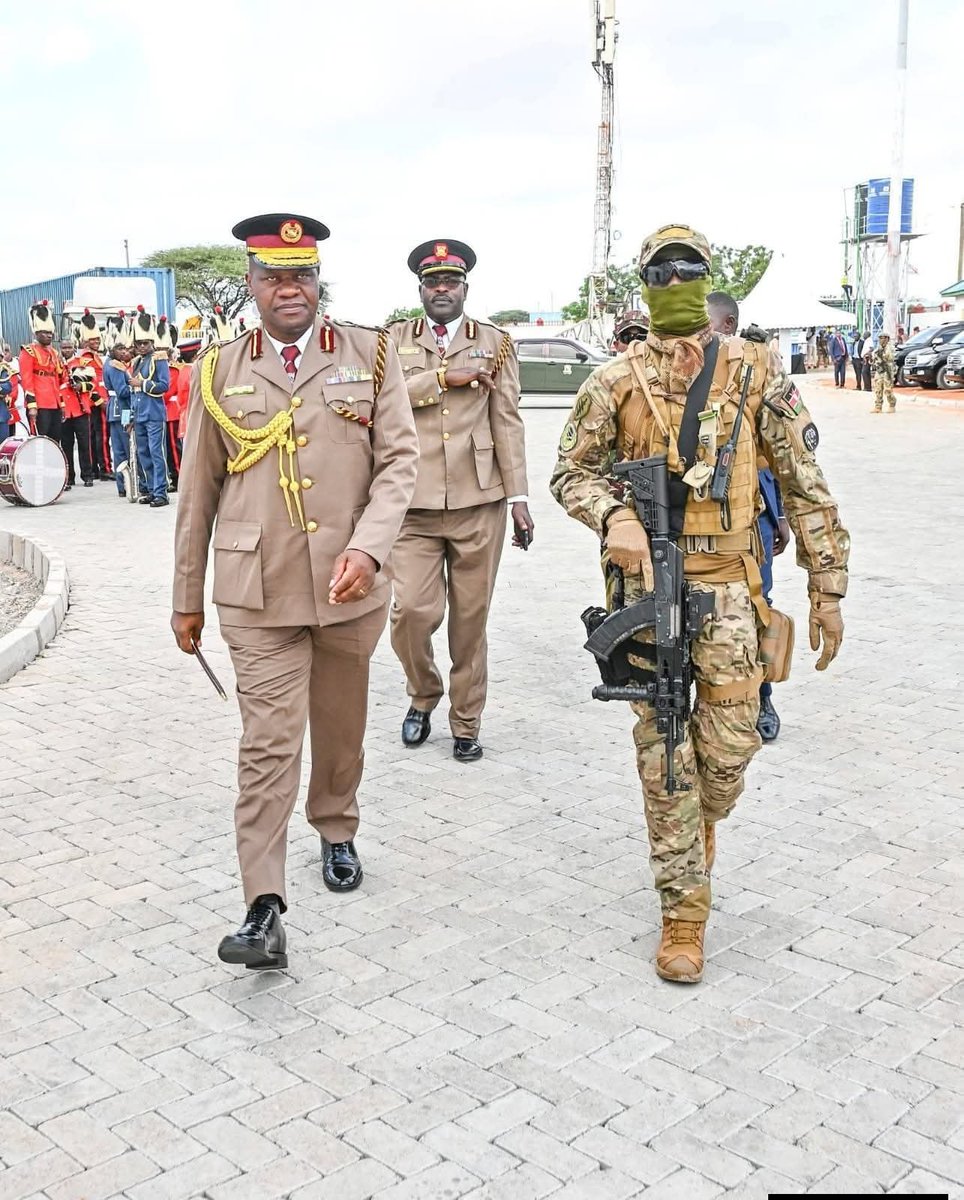 BRINATV's tweet photo. DIG Gilbert Masengeli is pictured being escorted by an officer from the Administration Police Service’s Special Operations Group (SOG). Masengeli is regarded as a pioneer of the unit and served as its first commanding officer before rising to become DIG. 
#KaziNaJapheth https://t.co/rZW6N35sFK