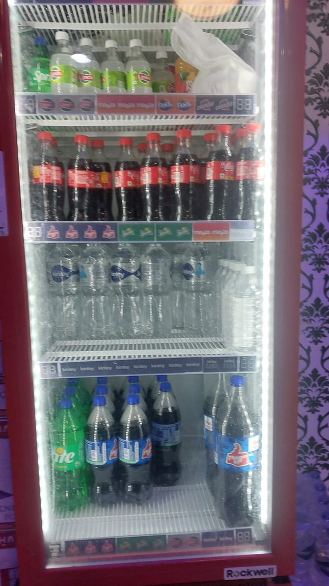 Miss_Soumya56's tweet photo. Yesterday, I went to a cafe, where I first had coffee. After that, I felt like drinking something cold.

So I asked the guy there for a bottle of Coke. But as soon as I got the bottle, I checked its expiration date.

To my surprise, the bottle had already expired.

What was most surprising was that the other Coke bottles in the fridge had also expired.

And many customers were buying and drinking them without checking the date. Perhaps no one noticed.

It's the responsibility of cafe or shop owners to ensure that customers are not given any expired products.

And to periodically check the expiration date of all products kept in the fridge.

But we also have a responsibility. Next time you buy Coke, juice, water, or any other packaged drink,

be sure to check the expiration date before drinking. Don't trust just the brand. A few seconds of caution can save you from trouble.