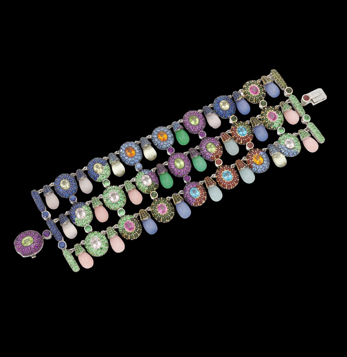 diamtrader's tweet photo. A jewel of unapologetic glamour.

This extraordinary de Grisogono bracelet is a celebration of colour, movement and unmistakable Italian-Swiss craftsmanship. 

Designed as a sumptuous three row fringe, its oval elements alternate with delicate drop shaped beads, creating a fluid silhouette that catches the light with every gesture.

Sapphires, garnets, amethysts, peridots, chalcedony and quartz bring a kaleidoscope of colour, beautifully set in 18 karat gold. 

Measuring approximately 180 mm and weighing an impressive 120 grams, the bracelet is signed and numbered, bearing de Grisogono’s maker’s mark and #Swiss and #Italian assay marks. 

Presented in its original stamped case and box.

A bold expression of the Maison’s exuberant approach to high jewellery where colour becomes attitude and every movement becomes a moment. #DeGrisogono #HighJewellery #FineJewellery #LuxuryJewellery #VogueStyle #JewelleryLovers #StatementJewellery #Gemstones #Sapphires #Amethyst #Garnet #Peridot #VintageJewellery #CollectibleJewellery #JewelleryCollector #SwissJewellery #ItalianJewellery #HauteJoaillerie
