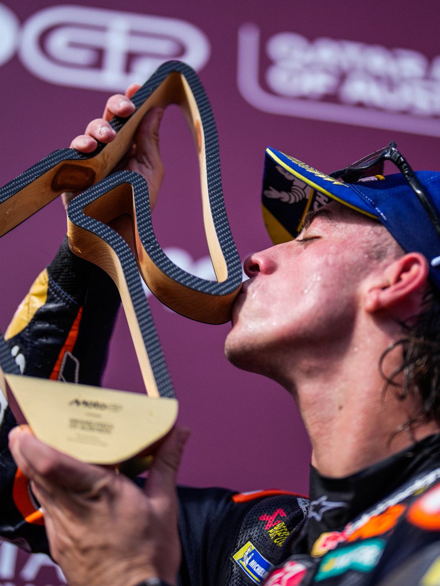 MotoGP's tweet photo. The first #MotoGP win sealed with a kiss! 😘🏆

#AustrianGP🇦🇹 https://t.co/shw0VmvaUr