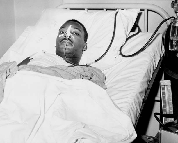 TheKingCenter's tweet photo. On this day in 1958, Dr. Martin Luther King, Jr. was stabbed in the chest by Izola Curry while signing copies of “Stride Toward Freedom” at a department store in Harlem.

The seven-inch blade came dangerously close to his aorta. Doctors later said that a sneeze or cough could have proved fatal.

Dr. King survived. But what followed became an enduring testament to the power of nonviolence.

From his hospital room, Dr. King expressed no hatred toward Curry. Instead, he spoke of her humanity and expressed hope that she would receive the help she needed. His response is a reminder that nonviolence is not weakness. It is the courageous decision to reject hatred, even when hatred has been directed at you.

Today, we remember Dr. King’s survival—and recommit ourselves to the work he yielded his life to advance:

HEAL HUMANITY.
HONOR TRUTH.
PRIORITIZE JUSTICE.
PRACTICE NONVIOLENCE.

The work continues. The Beloved Community is still possible—and it requires all of us.

#TheKingCenter #MartinLutherKingJr #MLK #Nonviolence #BelovedCommunity #CorettaScottKing

2nd photo: A letter opener protruding from his chest, Dr. King was treated at W. 123rd St. police station. (Photo by Vernoll Coleman/NY Daily News Archive via Getty Images)

3rd photo: Martin Luther King Jr. recovers from surgery in bed at Harlem Hospital in New York City on September 21, 1958, following an operation to remove a letter opener from his chest. (John Lent / AP)

4th photo: New York Governor Averell Harriman, left, talks with the Rev. Martin Luther King and his wife Coretta Scott King in Harlem Hospital, New York, Sept. 22, 1958. (AP Photo/Ray Howard)