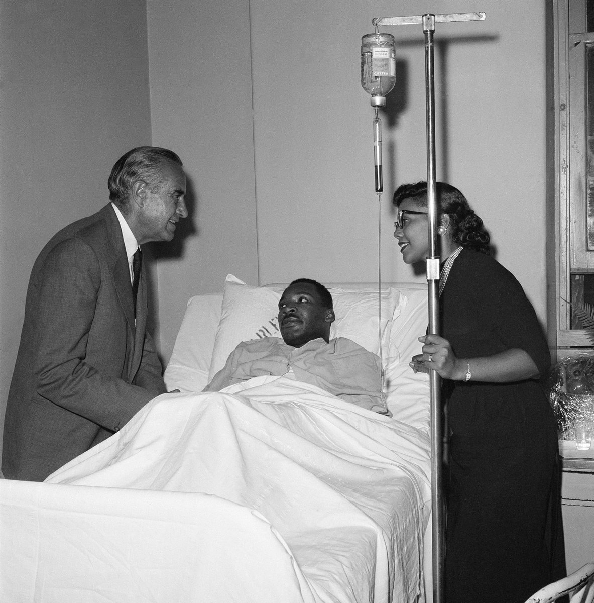 TheKingCenter's tweet photo. On this day in 1958, Dr. Martin Luther King, Jr. was stabbed in the chest by Izola Curry while signing copies of “Stride Toward Freedom” at a department store in Harlem.

The seven-inch blade came dangerously close to his aorta. Doctors later said that a sneeze or cough could have proved fatal.

Dr. King survived. But what followed became an enduring testament to the power of nonviolence.

From his hospital room, Dr. King expressed no hatred toward Curry. Instead, he spoke of her humanity and expressed hope that she would receive the help she needed. His response is a reminder that nonviolence is not weakness. It is the courageous decision to reject hatred, even when hatred has been directed at you.

Today, we remember Dr. King’s survival—and recommit ourselves to the work he yielded his life to advance:

HEAL HUMANITY.
HONOR TRUTH.
PRIORITIZE JUSTICE.
PRACTICE NONVIOLENCE.

The work continues. The Beloved Community is still possible—and it requires all of us.

#TheKingCenter #MartinLutherKingJr #MLK #Nonviolence #BelovedCommunity #CorettaScottKing

2nd photo: A letter opener protruding from his chest, Dr. King was treated at W. 123rd St. police station. (Photo by Vernoll Coleman/NY Daily News Archive via Getty Images)

3rd photo: Martin Luther King Jr. recovers from surgery in bed at Harlem Hospital in New York City on September 21, 1958, following an operation to remove a letter opener from his chest. (John Lent / AP)

4th photo: New York Governor Averell Harriman, left, talks with the Rev. Martin Luther King and his wife Coretta Scott King in Harlem Hospital, New York, Sept. 22, 1958. (AP Photo/Ray Howard)
