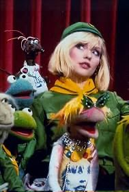 Picturethis74's tweet photo. Good morning everyone 💚NME (1987)

After Chris has fired a few more bursts “Is everybody in this country on dope? Or is it just a media thing?”; “That’s just what I was saying! Crack is exactly like an ad-campaign”, there is a knock at the door and a young man comes in. He says “I might go to Scotland this afternoon. Or maybe France.” Chris puts his scarf on and kisses Debbie. “See ya, honey”, he says and the two men disappear.
“This movie’s hysterical” Debbie says, “I just love it.” It looks like Kenneth Williams and Charles Hawtree poncing around in Nazi uniform. Debbie laughs and curls up on the sofa.
I saw you on The Muppet Show, Debbie.
She is momentarily embarrassed. “Aw, that was ages ago.” I saw it recently. 💚