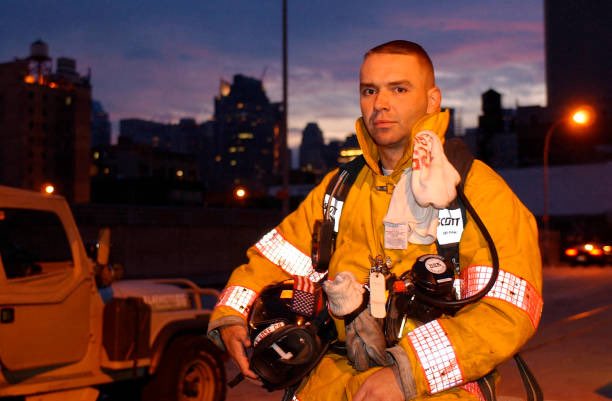 25YearsAgoLive's tweet photo. At dawn, French fireman J. F. Cote puts on his equipment and prepares to serve at Ground Zero.

Cote is the only known French firefighter who was present at the September 11 attacks and who is working to recover victims afterward. https://t.co/9XuFOLCwOG