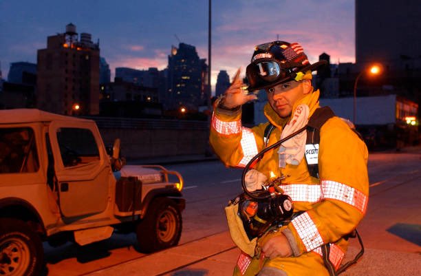 25YearsAgoLive's tweet photo. At dawn, French fireman J. F. Cote puts on his equipment and prepares to serve at Ground Zero.

Cote is the only known French firefighter who was present at the September 11 attacks and who is working to recover victims afterward. https://t.co/9XuFOLCwOG