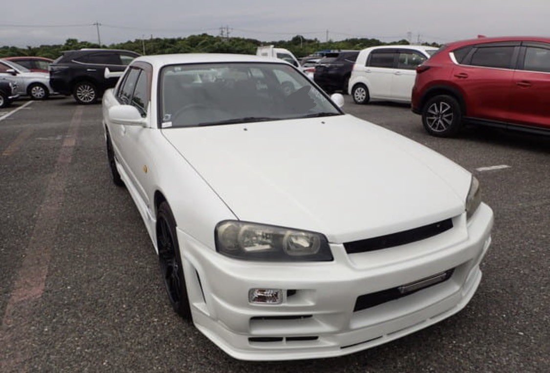 Gothbunnyart's tweet photo. My favourite guy!! My beautiful car! 

He doesn’t have a name yet, anyone have any suggestions?

He’s a beautiful Nissan Skyline R34 GT-X with turbo! (I’m probs gonna gut the engine, buy an RB26 and install it) he’s straight from Japan!

#skyline #nissanskyline #cars #jdm #r34 https://t.co/WMI9w5xplS