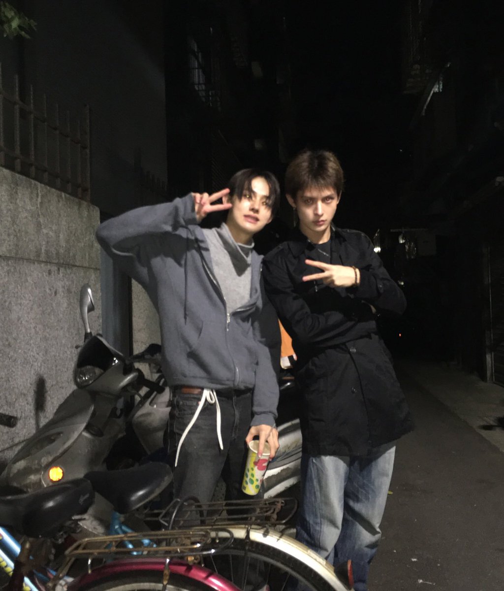 seonghyong's tweet photo. Late night strolls, a cold drink in hand, and navigating the quiet city alleyways after hours. Wrapped up in cozy hoodies, catching flash lit moments against the concrete backdrop, and making the simplest evening wander feel like an absolute scene. https://t.co/KiRAjawo9X