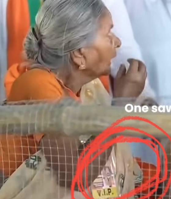 mikejava85's tweet photo. "Mata ji" has VVIP tag , Modi made her to wait for a chair till camera is on to do drama https://t.co/cqn20vjmQ9