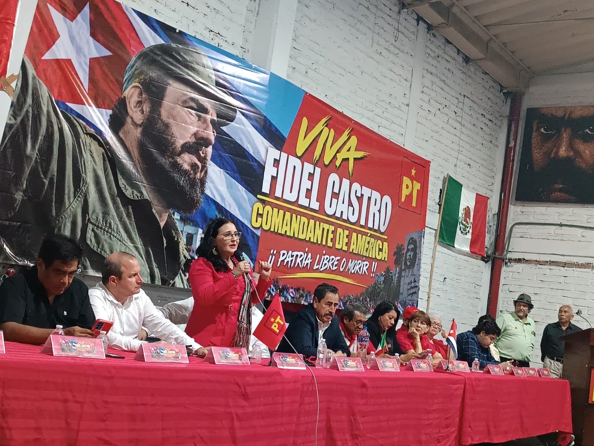 EmbaCuMex's tweet photo. 🇨🇺🤝🇲🇽 En un emotivo encuentro, que congregó a cientos de miembros del Partido del Trabajo (PT) y de otras fuerzas políticas, organizaciones sociales y populares mexicanas solidarias con Cuba, se celebró en Guadalajara el centenario del natalicio del Comandante en Jefe Fidel Castro Ruz.

En la sede estatal del PT en esa ciudad, la jornada contó con la presencia de una delegación de la Embajada de Cuba en México encabezada por el  Embajador Eugenio Martínez Enríquez.

Por la Parte mexicana presidió la actividad el Diputado Federal y líder del PT en Jalisco, José Luis Sánchez; Adalid Martínez, miembro de la dirección nacional del Partido del Trabajo; el Diputado local Leonardo Almaguer, Presidente del Grupo Parlamentario del PT en el Congreso de Jalisco; y líderes sindicales y sociales petistas.

El miembro de la dirección nacional del PT, Adalid Martínez, expresó en su intervención la importancia de redoblar la solidaridad con Cuba, generando acciones concretas que contribuyan a confirmar el histórico apoyo entre ambos pueblos. Resaltó la resistencia de Cuba ante las agresiones de los EEUU y confirmó que los cubanos pueden contar con México y el PT.

En el mensaje del Diputado Federal José Luis Sánchez,  destacó la importancia de la labor revolucionaria de Fidel en la historia de Cuba y de la humanidad, y cómo el legado del Comandante en Jefe sigue inspirando la lucha de los cubanos y de otros pueblos del mundo. Expresó que "Cuba elevó a niveles inimaginables la palabra independencia, la palabra soberanía, y la palabra dignidad, que son los valores que guían la resistencia de ese pueblo heroico e invencible, que es el pueblo cubano".

Por su parte el Embajador cubano resaltó el compromiso del Comandante en Jefe con cumplir la voluntad del pueblo, su legado de que no existen imposibles, y su optimismo vencedor como brújula para el pueblo cubano.

Se refirió a la historia de la política intervencionista y de dominación de los EEUU hacia Cuba, y denunció como genocidio a la actual escalada de las agresiones del gobierno estadounidense contra nuestro país, que incluye el cerco energético que junto a otras medidas que constituyen un castigo colectivo inmerecido. Reafirmó que "en Cuba hay una llama encendida que quiere ser apagada", y confirmó  que "en Cuba vencemos la incertidumbre con la resistencia y no con el sometimiento", reafirmando la disposición de los cubanos de defender su soberanía hasta las últimas consecuencias.

Enfatizó la dignidad y soberanía de México en la historia de América Latina y el Caribe. 

 Agradeció la solidaridad con el pueblo cubano del Partido del Trabajo y su líder Alberto Anaya, así como del gobierno y pueblo mexicanos. A los presentes expresó: "Cuba resistirá y no olvidaremos la ayuda de ustedes en momentos tan difíciles".

En un ameno intercambio, los amigos mexicanos ratificaron de forma unánime el compromiso inquebrantable de no claudicar en la solidaridad con Cuba.

En respuesta a preguntas del auditorio, la embajadora Johana Tablada explicó cómo se articula y decide la estrategia contra Cuba en los círculos políticos y de poder de EEUU.

Destacó el apoyo y solidaridad con Cuba en organismos internacionales, y de muchos países, incluyendo los EEUU, y ratificó que: "Cuba no está sola, y en el país donde más se siente eso es en México".

En el encuentro se reiteraron las consignas "Cuba sí, yanquis no", y "Cuba no está sola", que reafirmaron de manera contundente el respaldo y la hermandad de México con el pueblo cubano y su Revolución.

#100AñosConFidel