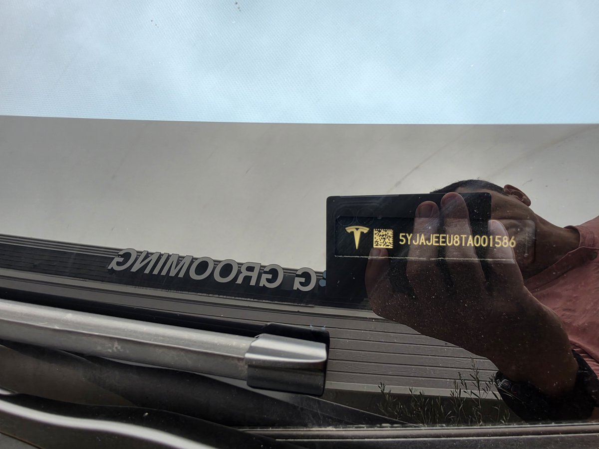 HeyRolandJ's tweet photo. Spotted this morning in San Jose, CA near Campbell.  Steering wheel and screen are covered by a Tesla branded jacket. There's an Nvme SSD hard drive on the floor connected to the vehicle perhaps for data collection. https://t.co/qg3ebp1TMk