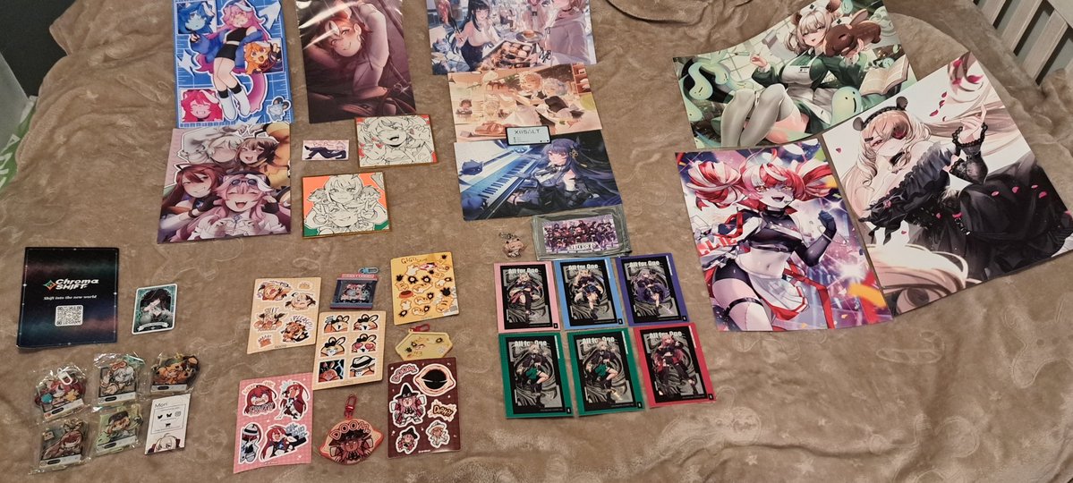 SirNinjaHusky's tweet photo. My merch haul for Vexpo 2026, minus a few NSFW things. #vexpo #hololive #nimi https://t.co/HoYfh7F5W1
