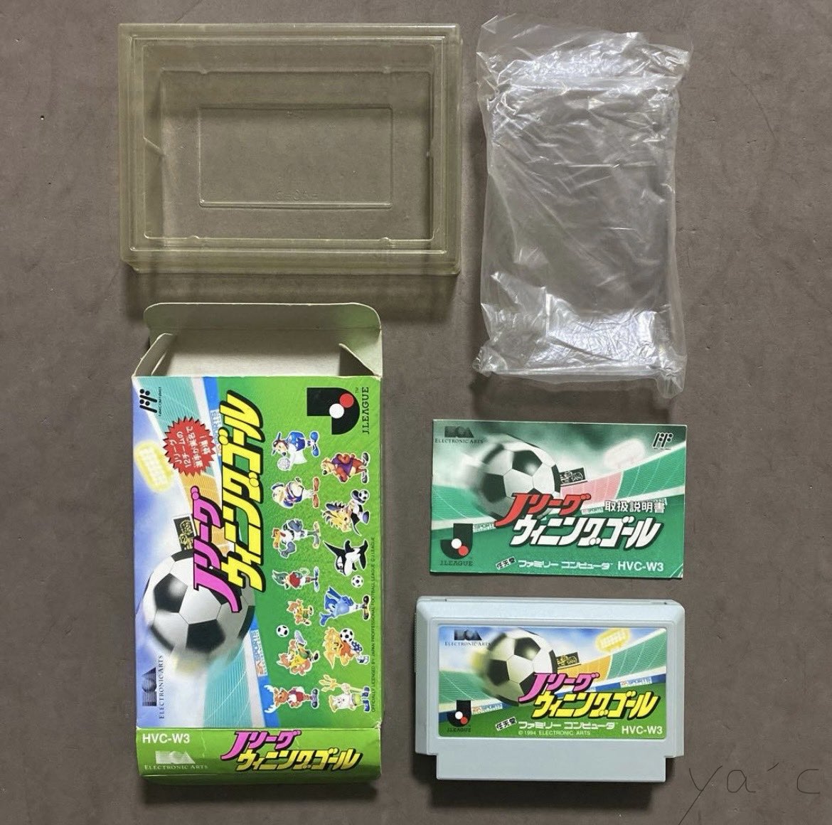 YamadaFCJP's tweet photo. Day 82  / 180

Today’s Famicom Collection from Japan

J.League Winning Goal (1994)

I could never join the excitement around me.

Whenever a festival sprang up around me,
I never knew how to take part.

In 1993, the J.League began.

Turn on the television: football.
Open a newspaper: football.
At work, everyone discussed yesterday’s match.
I smiled and let it pass me by.

It seemed all of Japan had been swept up in the excitement.

I was about twenty-four,
in my second year at a bank.

Work was relentless.

I didn’t watch football.
I hardly watched television at all.

So it wasn’t only footballers I didn’t know.
I didn’t even know celebrities.

Whenever everyone started asking,

“Did you see that last night?”

I felt as though I alone
had lived through a different yesterday.

How could everyone watch the same thing,
laugh at the same moments,
and become so excited about the same match?

Were they really watching football?

Or were they watching
because everyone else was watching?

It wasn’t only about the match.

Watching the same thing,
celebrating at the same moment,
and talking about it the next day—

that, too, was part of the festival.

But back then, I couldn’t do it.

I didn’t hate or oppose it.

It simply didn’t move me.

I didn’t know how to become excited about something
just because everyone around me was.

Sometimes I wondered
if there was something wrong with me.

So was I pouring all that passion
into video games instead?

Unfortunately, no.

Work kept me so busy
that I didn’t even have time to play.

Everyone around me had a festival.

I didn’t even have one of my own.

In my early thirties,
things at work stopped going well.

People tend to miss the past
when they feel defeated.

At least, I did.

When looking forward became difficult,
I remembered the games I had played as a child.

Back then, I hadn’t played them
to have something in common with anyone.

I played simply because I loved them.

By my late thirties,
I had fallen deeply into retro gaming.

As I collected old games,
perhaps I was also gathering up
the pieces of myself I had left behind with them.

Recently,
I acquired J.League Winning Goal.

I never played this game in 1994.

It holds no football memories for me.

I didn’t buy it out of nostalgia.

Yet this cartridge contains
a time I unquestionably lived through.

All of Japan seemed captivated
by the new J.League.

Meanwhile, after eleven years,
the Famicom was quietly nearing its end.

A game filled with a new national festival
became the second-to-last release
for an old console.

More than thirty years later,
the festival I never joined
came to me as a single cartridge.

Eventually, I understood.

There had always been others like me.

We simply couldn’t find one another.

People swept up in excitement
gather and raise their voices.

Those who aren’t interested
remain silent, scattered in different places.

And yet these days,
I’m happy whenever Shohei Ohtani hits a home run.

Nobody asks me to,
but I go online
and search for the video and articles.

The man once puzzled by collective excitement
now refreshes the screen whenever Ohtani steps up to bat.

Human beings aren’t all that consistent.

I had always been capable
of sharing joy with other people.

My heart simply didn’t run
on the same timetable as everyone else.

P.S.

J.League Winning Goal was released by Electronic Arts Victor on May 27, 1994.

It features all 12 J.League clubs that season—including new arrivals Jubilo Iwata and Bellmare Hiratsuka—and real player names.

It arrived 21 days before the 1994 World Cup began in the United States, and one release before Adventure Island IV, the final Famicom game. It was the second-to-last Famicom title ever released.

The copy in today’s photograph joined my collection only recently.

Even a game I never played then can look nostalgic now.

Human memory is remarkably convenient.