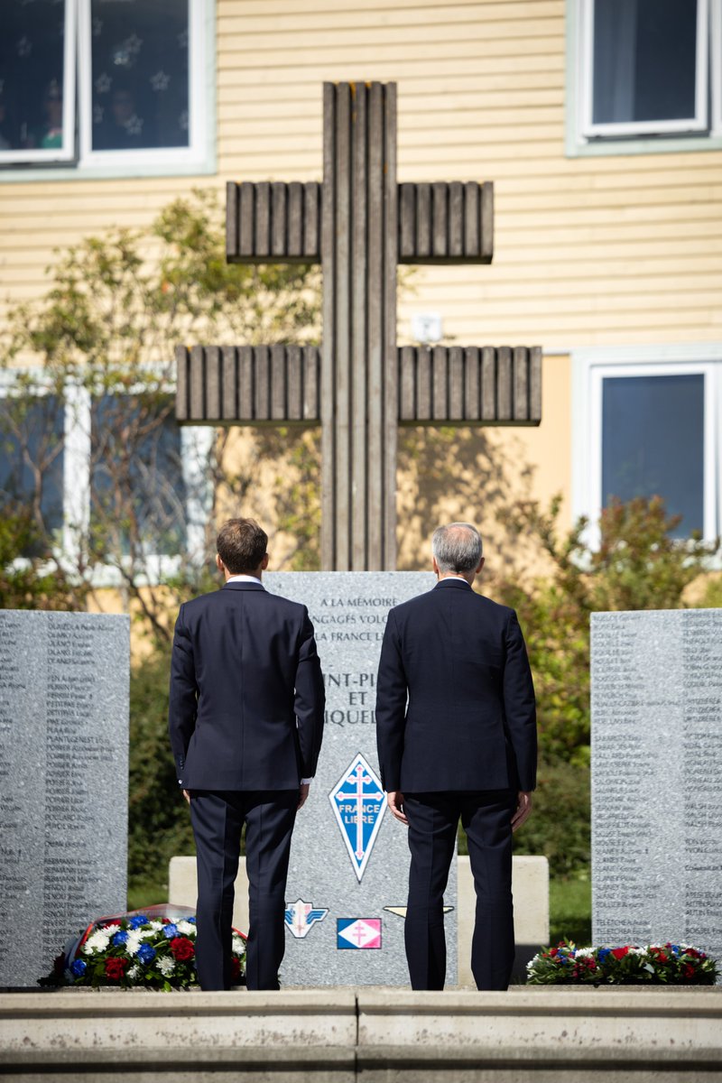 Prime Minister Mark Carney and the President of France, Emmanuel Macron, stand in silence to honour the Free French during a wreath-laying ceremony in Saint-Pierre-et-Miquelon, France.