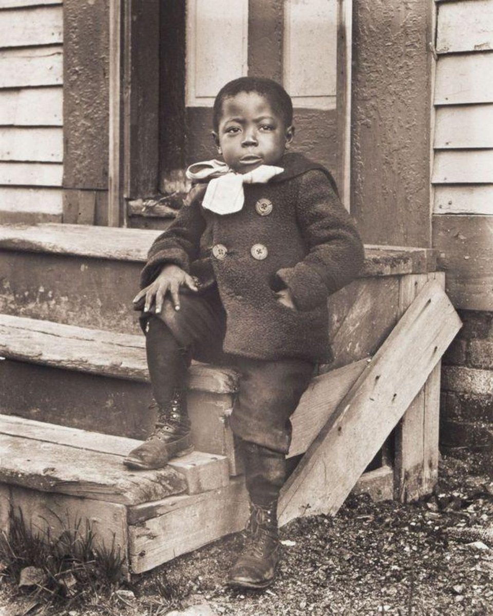 AfricanArchives's tweet photo. Little boy poses prodly with his winter coat, circa 1902. https://t.co/iiJQxhm0y1
