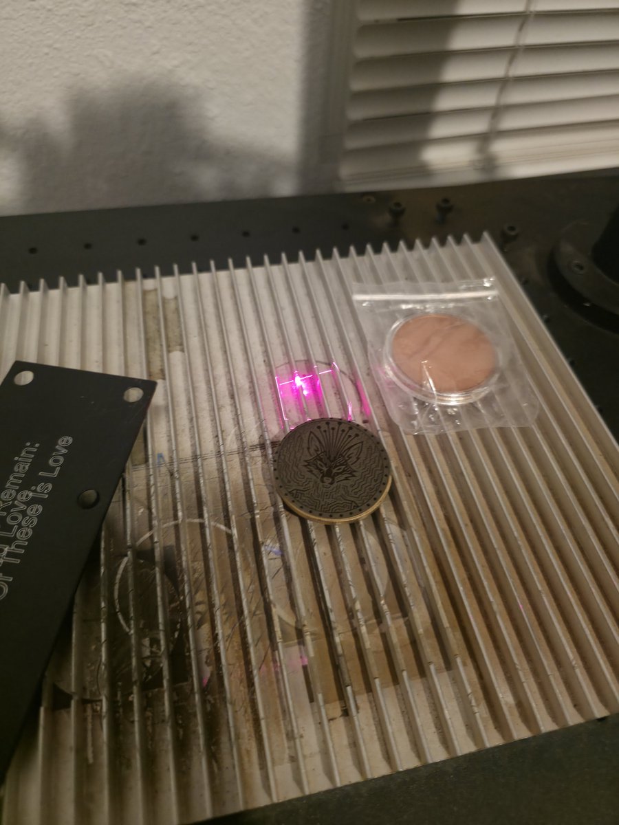 Zoltan_Hank's tweet photo. Laser engraving my robinhood collection onto some brass coins. 

Front has NFT image, back has collection information and QR code containing the seed phrase for the wallet it is owned by, with just enough eth to fund transfer out of wallet.

I can handle out physical NFT'S.

RH POGS is my first real collection. ive spent (accidentally) hundreds of dollars on the art generation. 

If i mailed you your NFT, are you bullish? 

https://t.co/wCZjVsQNGq