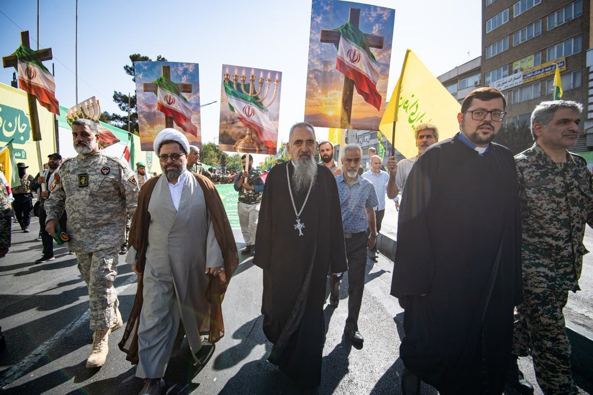 Azadar04's tweet photo. Iranian Muslims, Christian and Jews marching side by side in Tehran against the United States and Israel.

@iranscreenshot https://t.co/1I0c6AaPtY