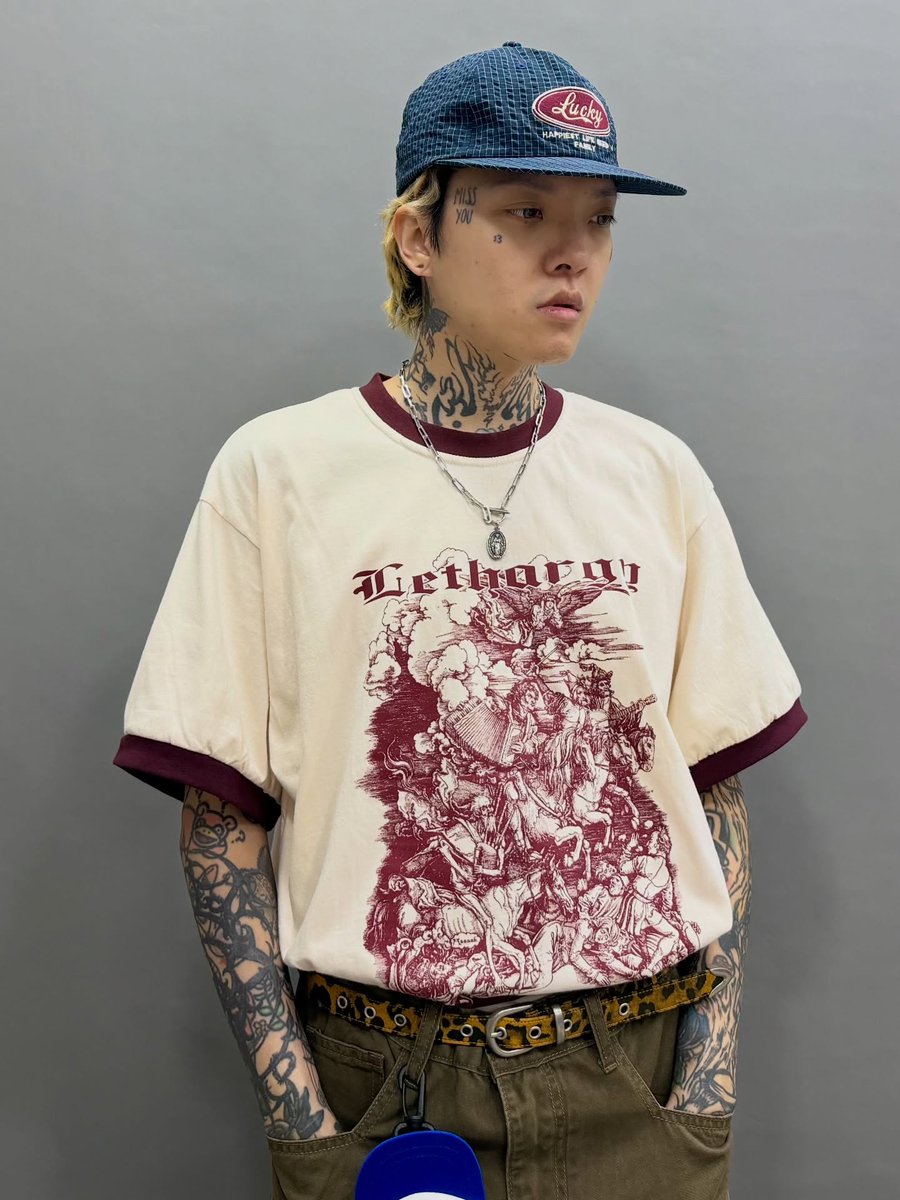 PollyPatriquin's tweet photo. Navy checkered cap, Virgin Mary necklace, beige Lethargy print tee, brown curved draped pants, leopard-print belt, cap keychain, and sand-colored chunky loafers. One-time purchases over $800 qualify for VIP discounts: 10% off Korean items and 5% https://t.co/t6lDrEb3Zv