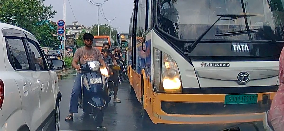 utkarsh__parekh's tweet photo. How are these dangerous drivers allowed on Ahmedabad roads? BRTS Bus GJ01JT3322 intentionally hit my car near Chandola Lake yesterday. If it was a 2-wheeler, someone could have died. @AhmedabadAMC must terminate this driver and compensate for damages immediately! Yesterday because of heavy rain and water logging we were driving in brts lane but it doesnt mean brts bus have right to harm us.  #Ahmedabad #BRTS @GujaratPolice @vnehra @AhmedabadBRTS @AMCommissioner